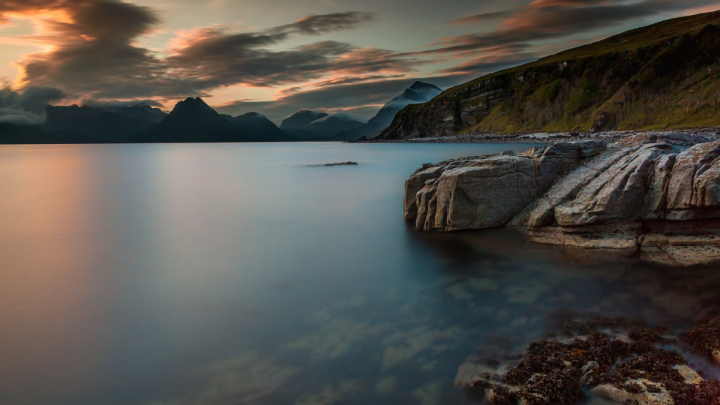 lake with rocks coming out of water